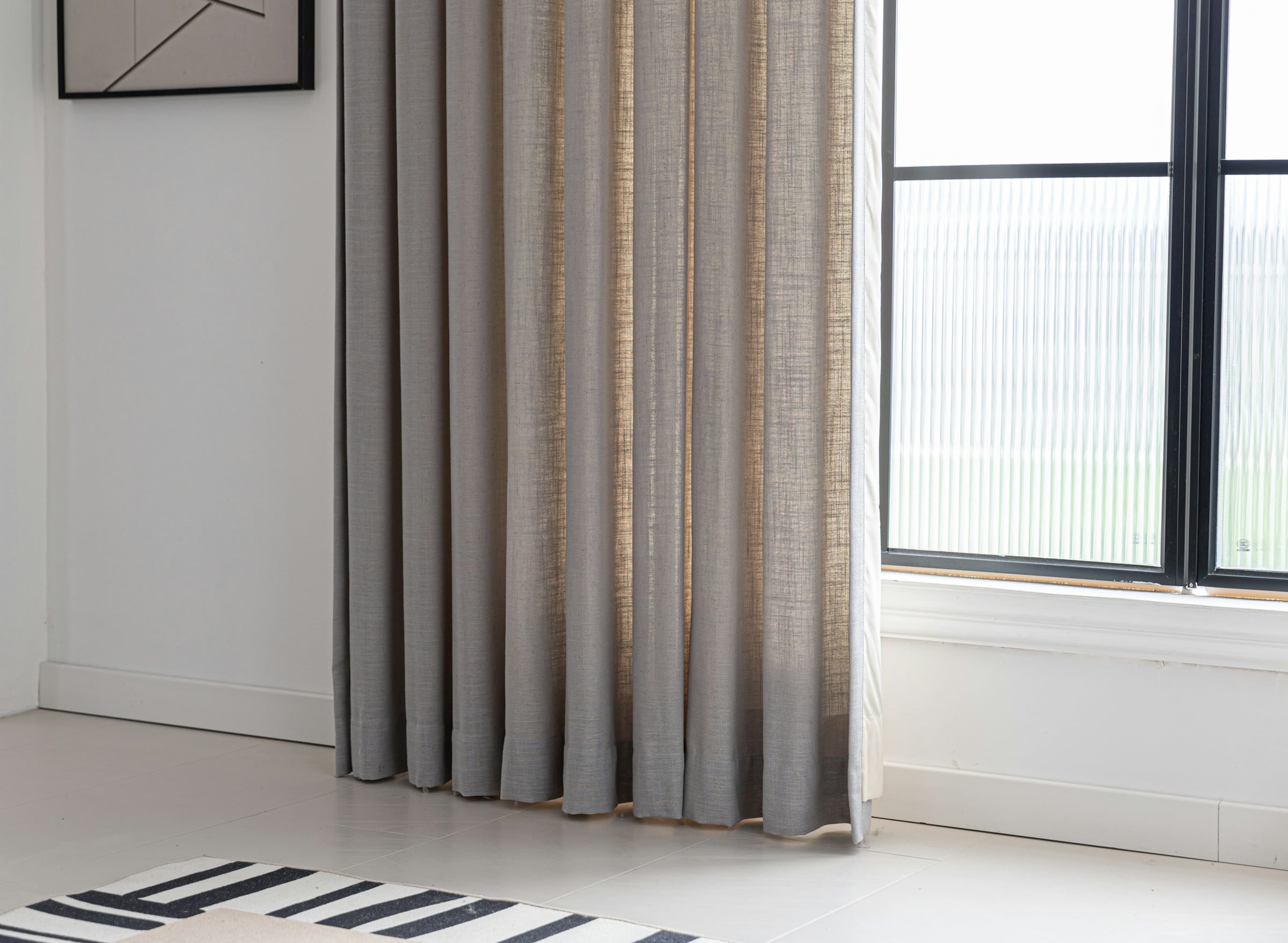 Custom linen curtain detail, floor-to-ceiling drapery